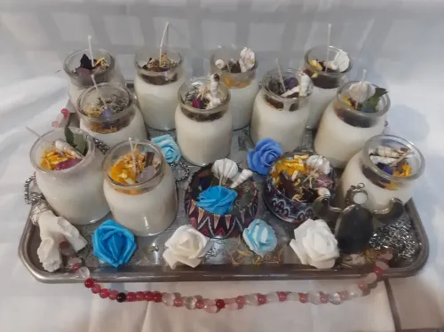 Velas artesanales con flores escencias y caracoles